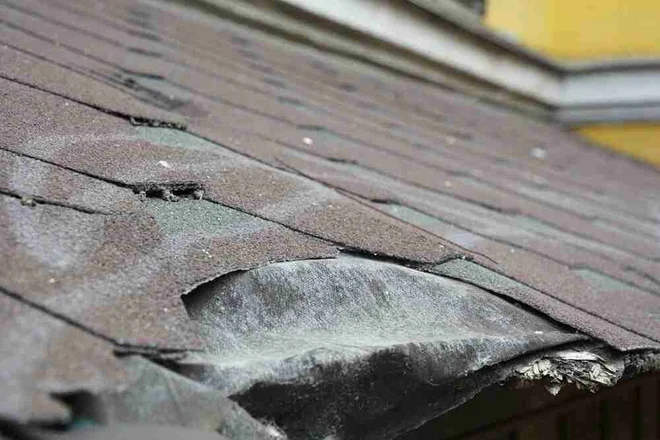 Asphalt shingles damage. Roofing shingles asphalt. Fixing damaged roof shingles.