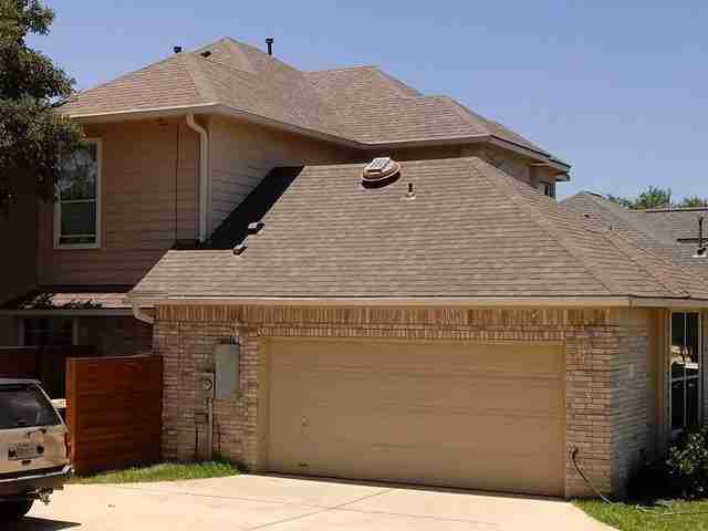 Residential home with new roof by Sprauer